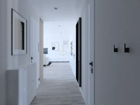 Przedpokój w stylu industrialnym, minimalistycznym i współczesnym z białymi drzwiami.