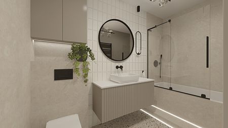 Wnętrze łazienki z umywalką, lustrem i rośliną w stylu japandi.