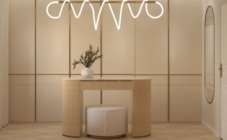 Przedpokój w stylu art deco z beżową konsolą i minimalistycznym lustrem.