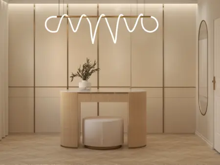 Przedpokój w stylu art deco z beżową konsolą i minimalistycznym lustrem.