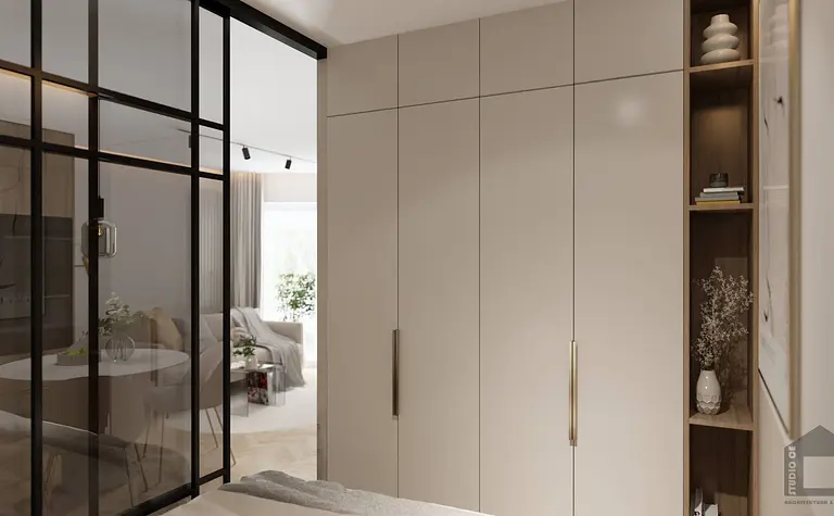 Garderoba w stylu glamour i japandi z białymi meblami i szklanymi drzwiami.