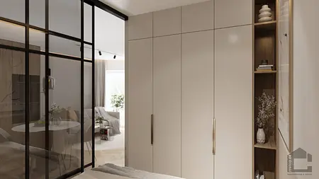 Garderoba w stylu glamour i japandi z białymi meblami i szklanymi drzwiami.