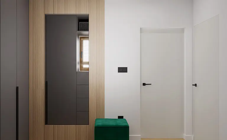 Przedpokój w stylu minimalistycznym z szafą i zielonym siedziskiem.