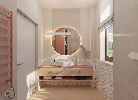 Wnętrze łazienki z różowym blatem, okrągłym lustrem i nowoczesnymi akcentami.