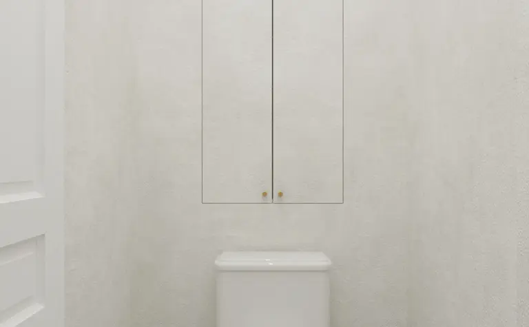 Toaleta w stylu art deco z białą ceramiką i szarym wykończeniem, minimalistyczne detale.