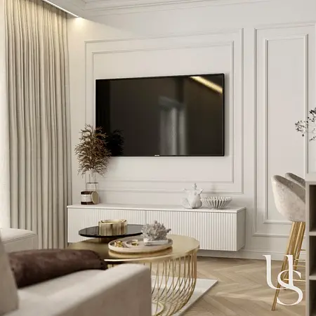Nowoczesny salon z białymi meblami i złotymi detalami w stylu glamour.