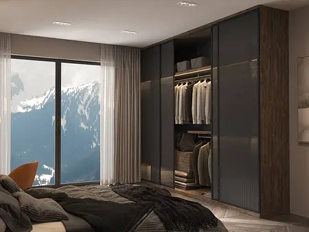 Garderoba z szarymi meblami, drewnianymi akcentami i widokiem na góry.