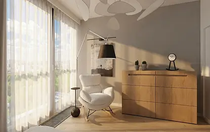 Minimalistyczne wnętrze pokoju z białym fotelem i drewnianą komodą.