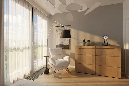 Minimalistyczne wnętrze pokoju z białym fotelem i drewnianą komodą.