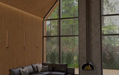 Wnętrze salonu w stylu industrialnym z dużymi oknami i skórzanym kompletem mebli.