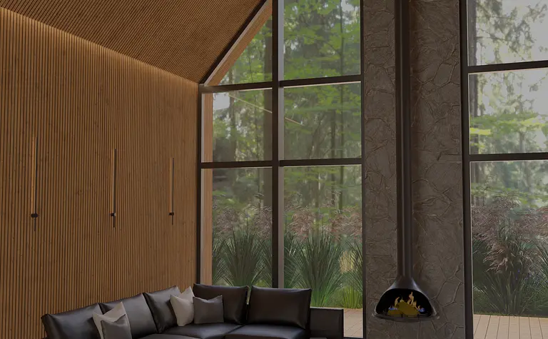 Wnętrze salonu w stylu industrialnym z dużymi oknami i skórzanym kompletem mebli.