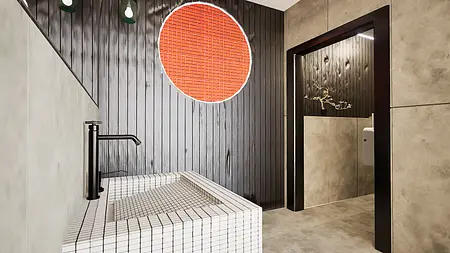 Wnętrze łazienki z minimalistycznym designem, białą wanną i czarnymi detalami, styl minimaluxe.