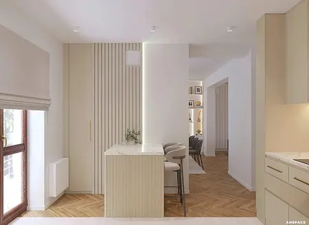 Wnętrze nowoczesnej kuchni z jasnymi meblami i drewnianą podłogą.