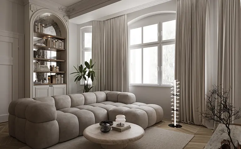 Eklektyczny salon z beżową sofą, drewnianym stolikiem i rośliną.