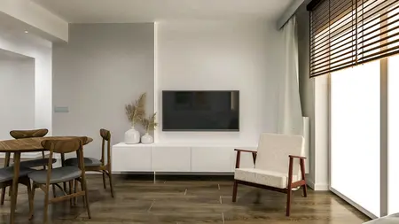 Wnętrze salonu z minimalistycznym wystrojem, drewnianym stołem, telewizorem i roślinami.