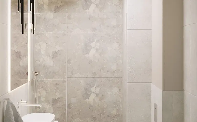 Nowoczesna łazienka z minimalistycznym designem, szarymi płytkami i białymi elementami.