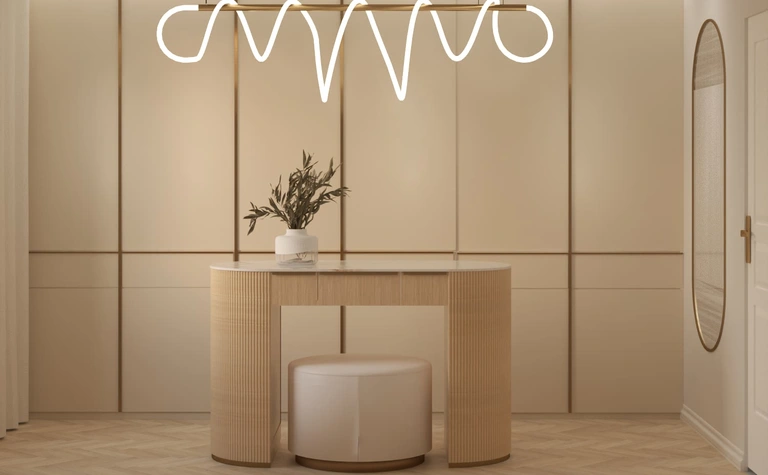 Przedpokój w stylu art deco z beżową konsolą i minimalistycznym lustrem.