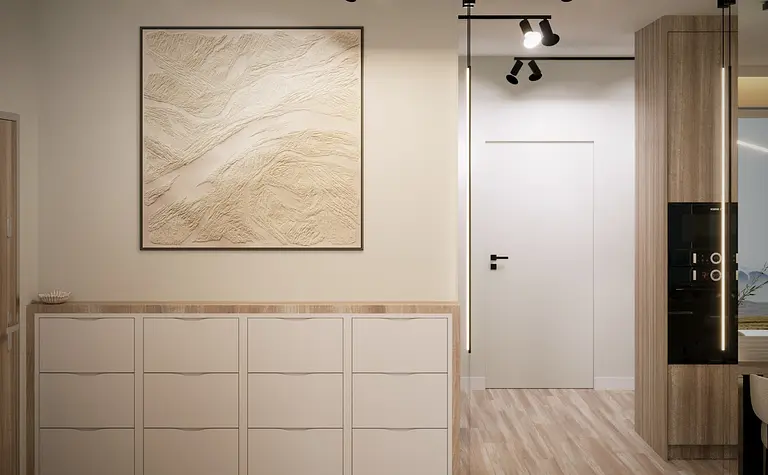 Przedpokój w stylu minimalistycznym i nowoczesnym z białymi meblami i drewnianą podłogą.