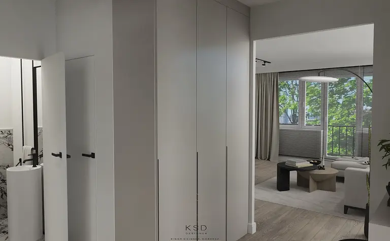 Nowoczesne wnętrze z białymi meblami i szarymi detalami, okna z widokiem na zewnątrz.