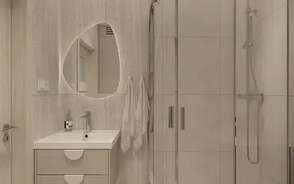 Nowoczesna łazienka z prysznicem i minimalistycznymi meblami.