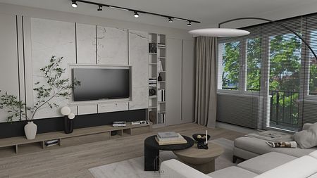 Wnętrze salonu z jasnymi meblami i ciemnymi detalami, nowoczesny design.