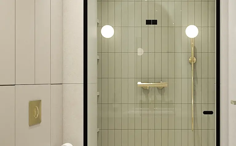 Nowoczesna łazienka z szarymi płytkami, złotymi akcentami i białym WC