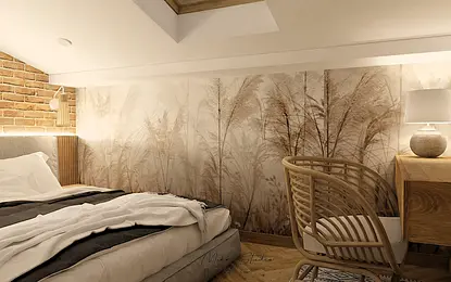 Sypialnia boho z ceglaną ścianą i drewnianym biurkiem.