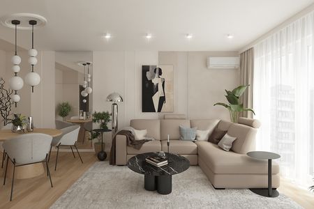 Wnętrze salonu w stylu minimaluxe z beżową sofą i czarnym stolikiem.