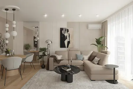 Wnętrze salonu w stylu minimaluxe z beżową sofą i czarnym stolikiem.