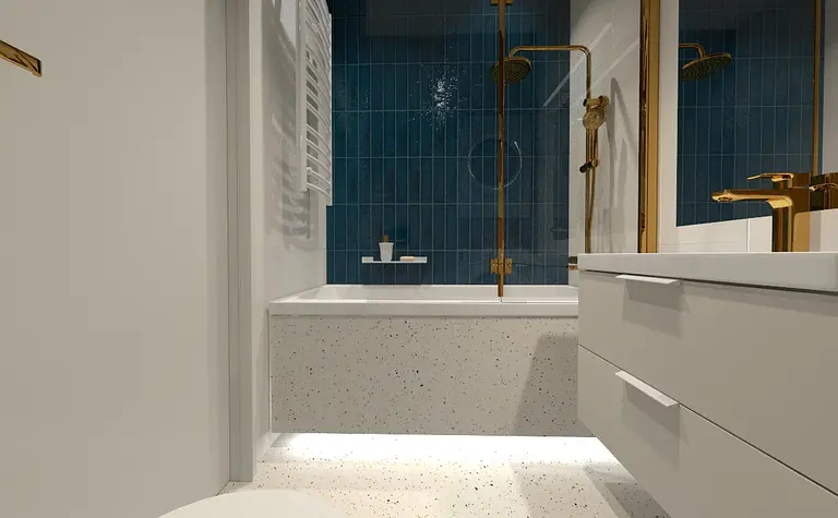 Współczesna łazienka z niebieskimi kafelkami, wanną i złotymi detalami.