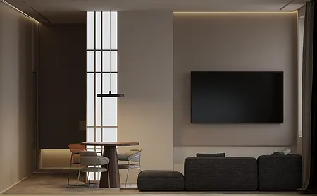 Nowoczesne wnętrze z telewizorem, drewnianym stołem i szarymi fotelami.