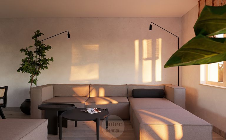 Salon w stylu japandi i minimalistycznym z szarym narożnikiem i rośliną