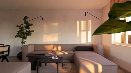 Salon w stylu japandi i minimalistycznym z szarym narożnikiem i rośliną