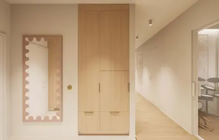Minimalistyczny przedpokój w stylu japandi z drewnianą szafą i lustrem.