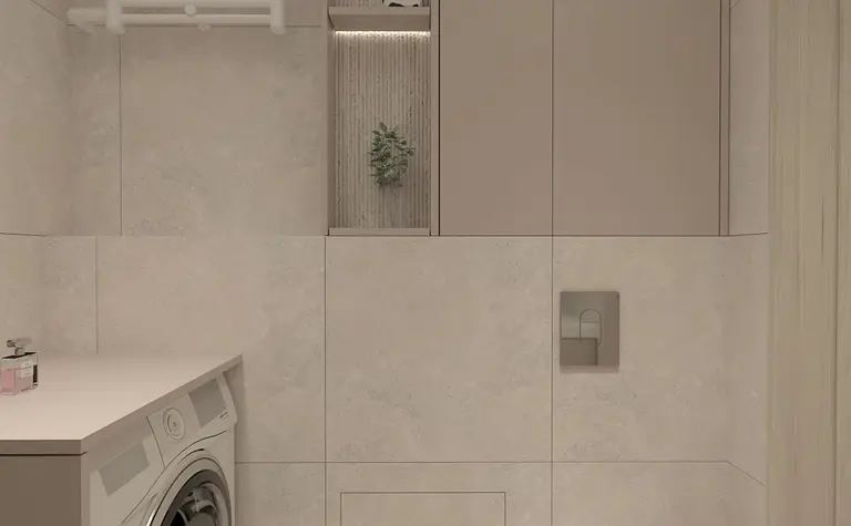 Wnętrze łazienki z pralką, jasnymi płytkami i nowoczesnymi akcentami.