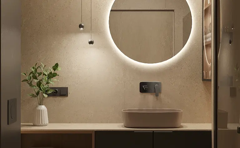 Nowoczesna łazienka z okrągłym lustrem, minimalistycznym designem i naturalnymi materiałami.