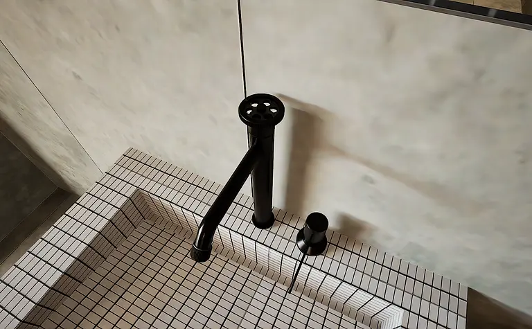 Widok na czarny kran w minimalistycznej łazience z kafelkami.