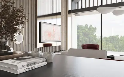 Wnętrze minimalistycznego salonu z TV, książkami i roślinami.
