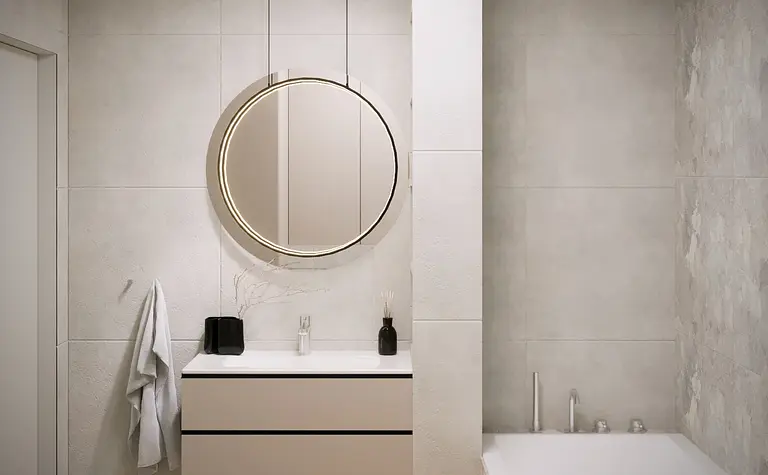 Nowoczesna łazienka z okrągłym lustrem i minimalistycznym stylem