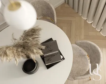 Jadalnia z okrągłym stołem, szarymi krzesłami i dekoracjami glamour.