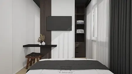 Wnętrze sypialni z minimalistycznym designem, nowoczesnym biurkiem i współczesnymi detalami.
