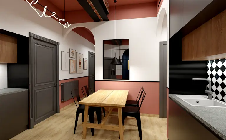 Wnętrze kuchni z drewnianym stołem, czarnymi krzesłami i akcentami dopamine decor.