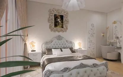 Sypialnia w stylu glamour z białym łóżkiem, ozdobnymi lampami i eleganckim lustrem.