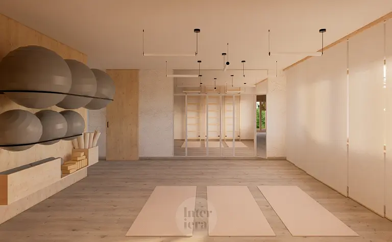 Przestronny pokój do ćwiczeń w stylu japandi i minimalistycznym z drewnianymi detalami.