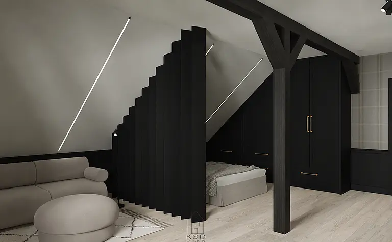 Wnętrze poddasza z minimalistycznym wystrojem, czarna szafa i jasna sofa.