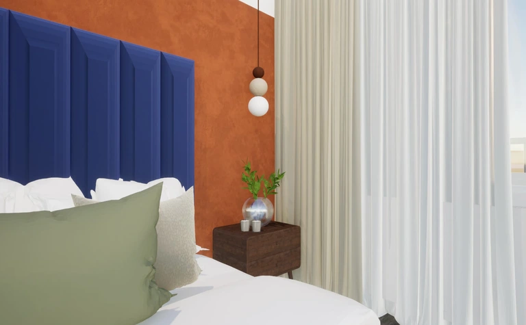 Sypialnia w stylu dopamine decor i skandynawskim z niebieską ścianą i rośliną.