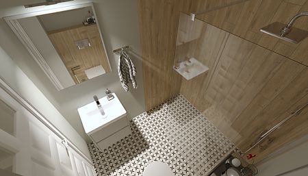 Współczesna łazienka z białą umywalką, drewnianymi ścianami i nowoczesnym prysznicem.