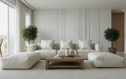 Minimalistyczny salon z białymi meblami i drzewkami w doniczkach