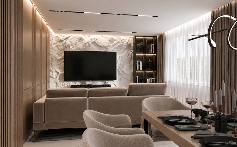 Wnętrze salonu w stylu japandi z beżową sofą i drewnianymi detalami.