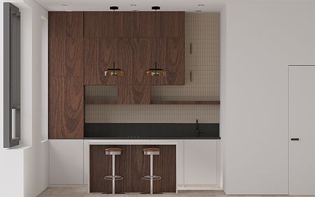 Wnętrze kuchni z drewnianymi meblami, czarnym blatem i nowoczesnym oświetleniem.